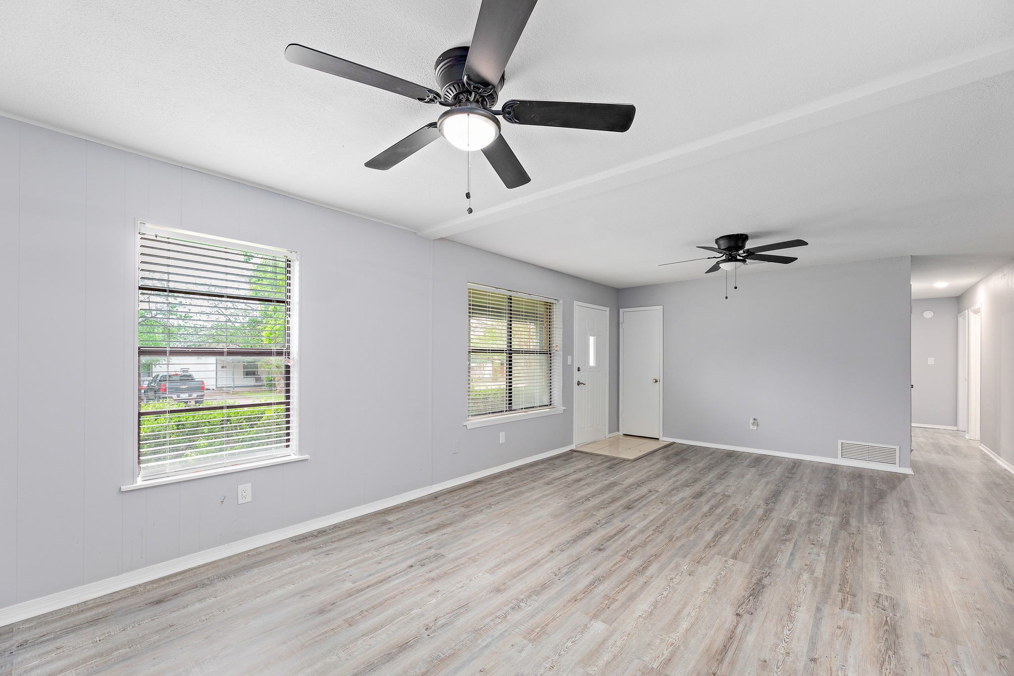 205 Hitching Post Road Kyle, TX 78640 - Photo 6 of 20 Soft paint tones, updated fixtures, and black-trimmed windows that sharpen the whole look.