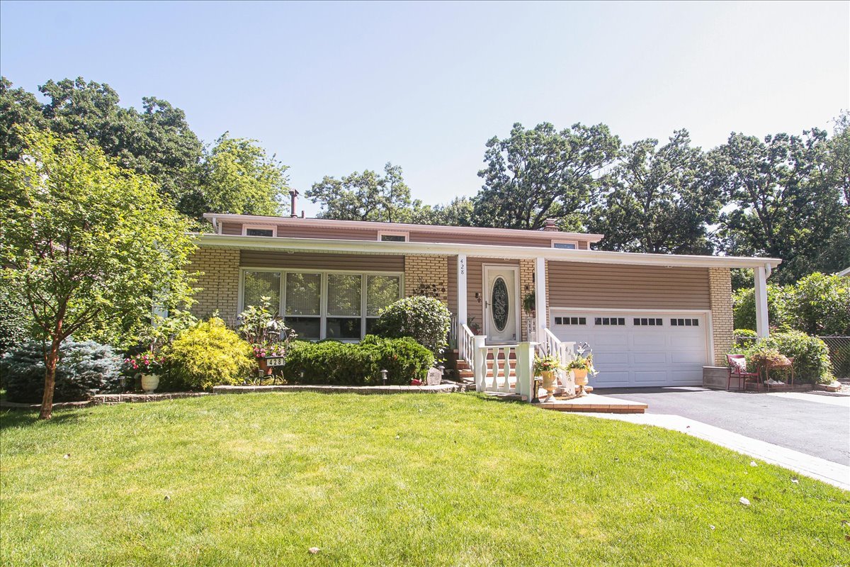 428 Spruce Drive Schaumburg, IL 60193 - Photo 1 of 1 front view of a house with patio