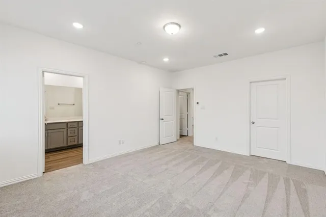 a bathroom with a shower sink and mirror