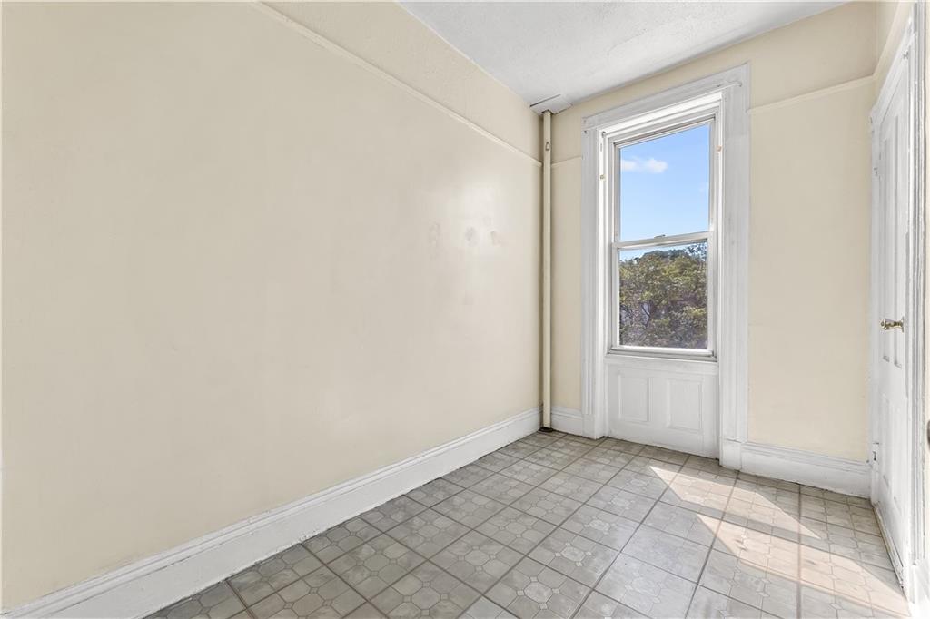 1271 Bushwick Avenue Brooklyn, NY 11207 - Photo 11 of 13 a view of an empty room and window