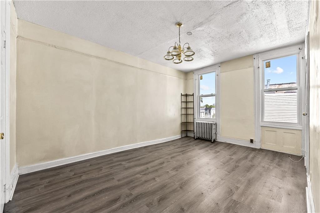 1271 Bushwick Avenue Brooklyn, NY 11207 - Photo 5 of 13 a view of an empty room with a window