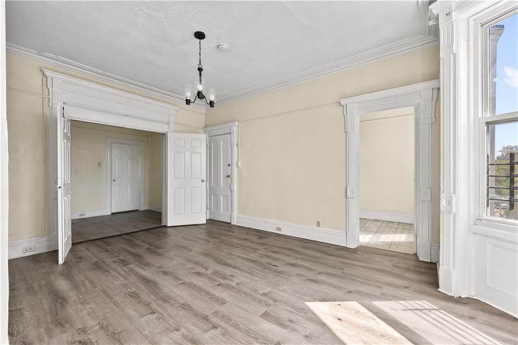 1271 Bushwick Avenue Brooklyn, NY 11207 - Photo 10 of 13 a view of an empty room with wooden floor