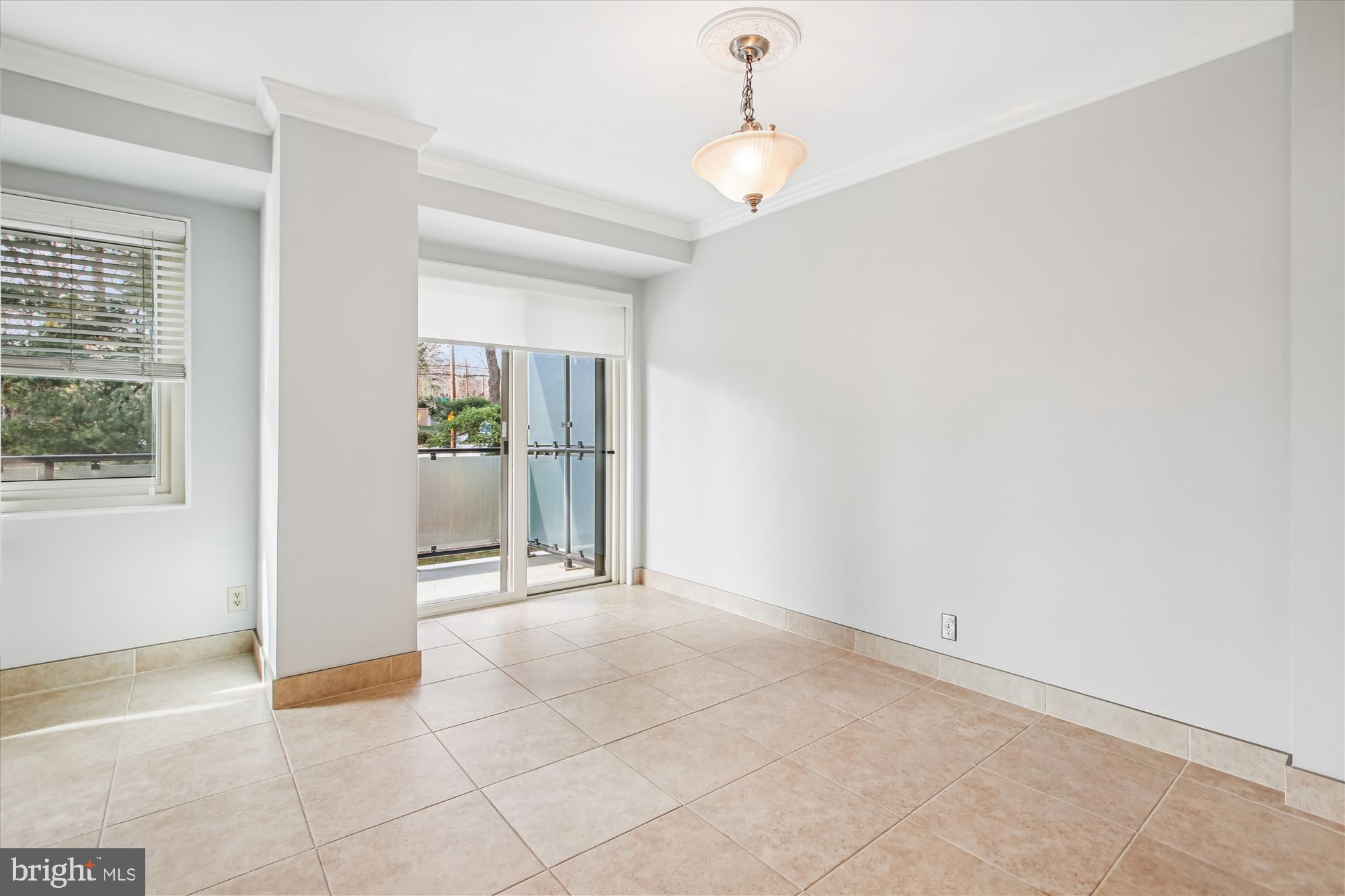 4201 Cathedral Avenue Northwest, Unit 407W Washington, DC 20016 - Photo 12 of 54 a view of an empty room with a window