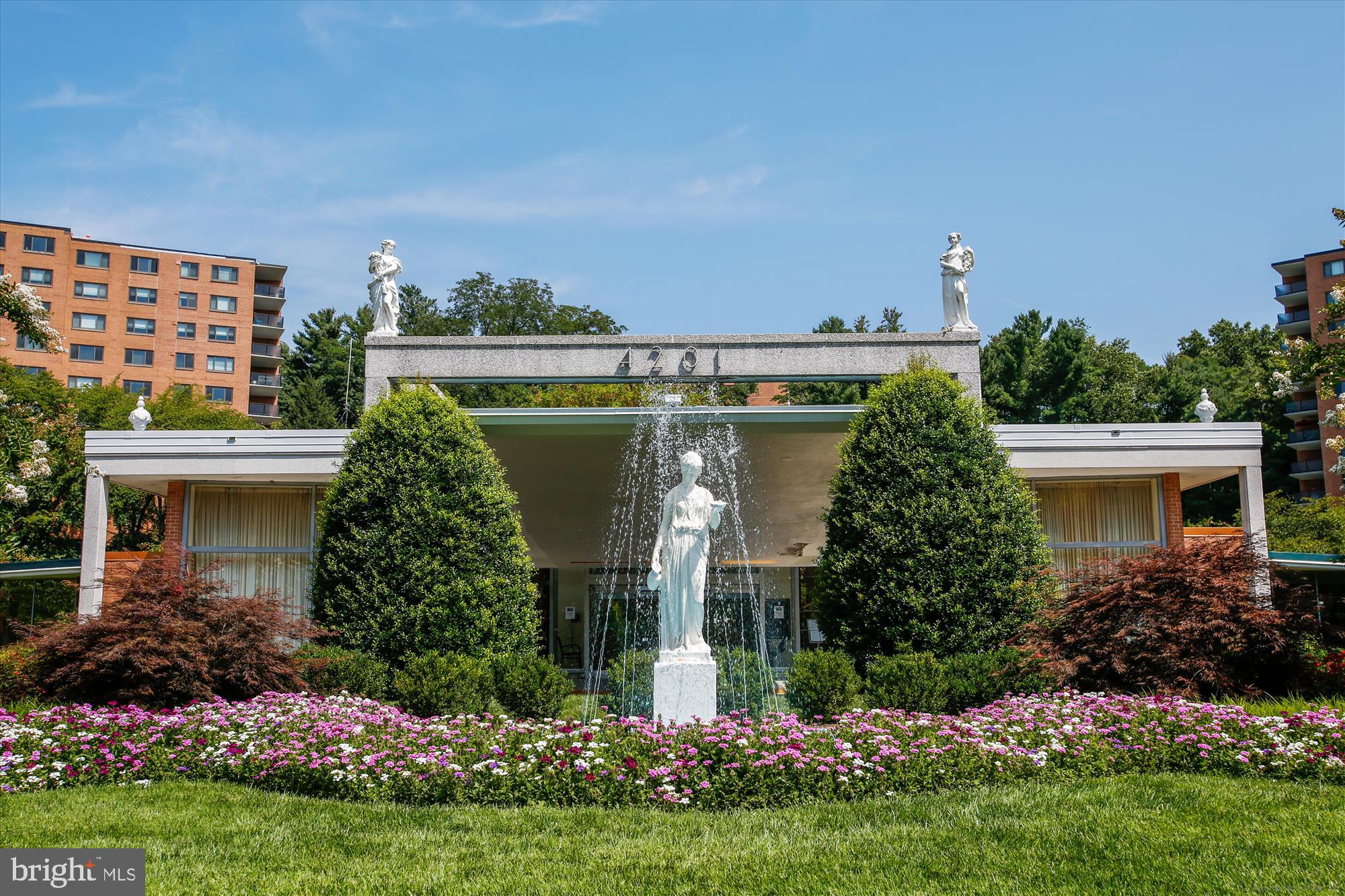 4201 Cathedral Avenue Northwest, Unit 407W Washington, DC 20016 - Photo 31 of 54 a front view of a house with a garden