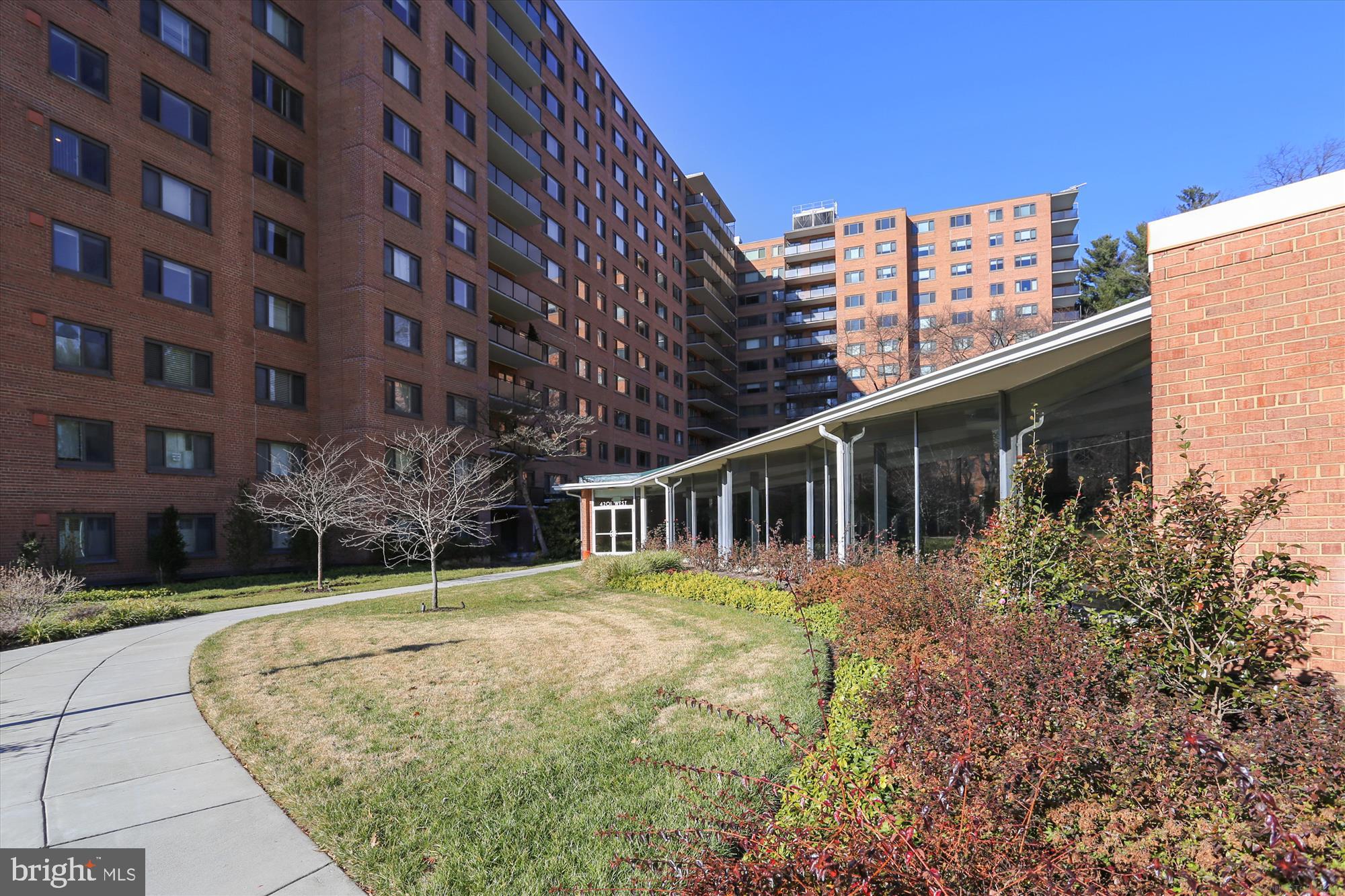 4201 Cathedral Avenue Northwest, Unit 407W Washington, DC 20016 - Photo 32 of 54 front view of a house with a yard