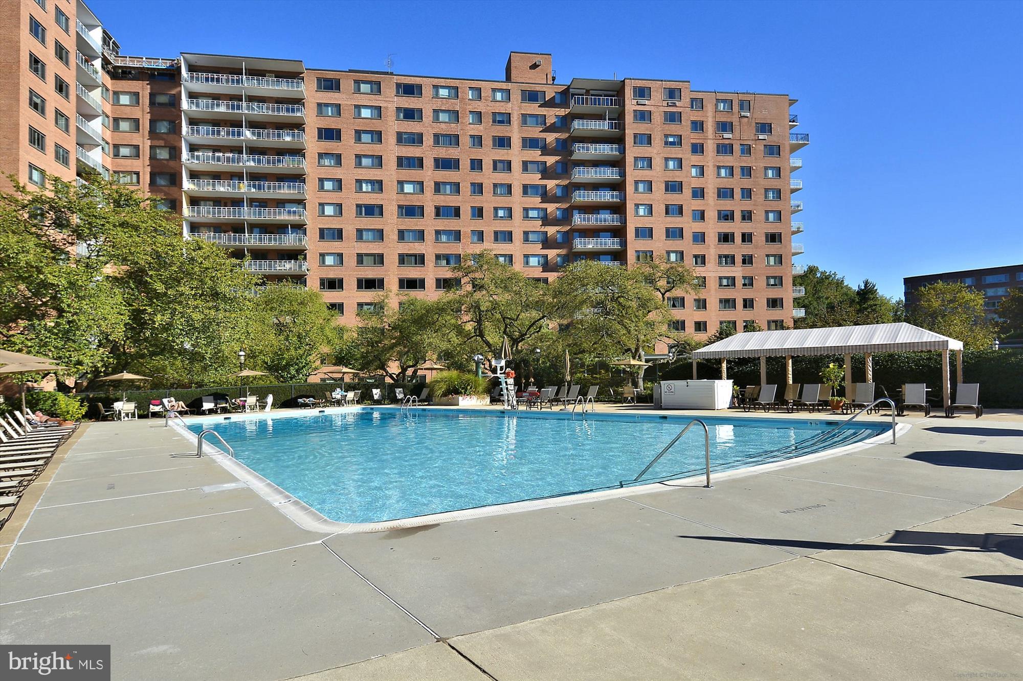 4201 Cathedral Avenue Northwest, Unit 407W Washington, DC 20016 - Photo 37 of 54 a view of a swimming pool and outdoor space