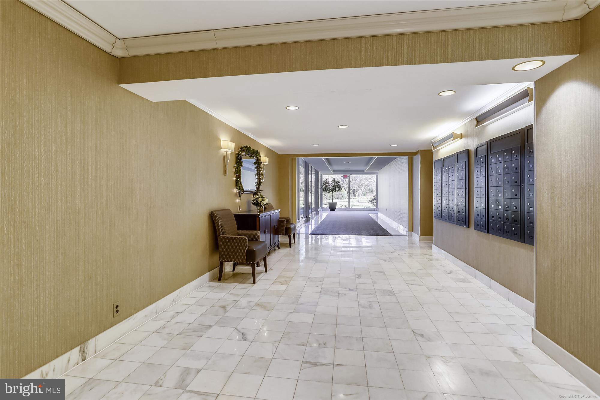 4201 Cathedral Avenue Northwest, Unit 407W Washington, DC 20016 - Photo 6 of 54 a view of a hallway with a chair and dining table