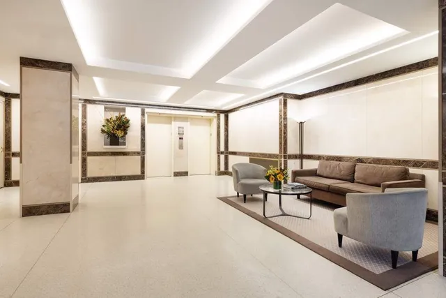 a bathroom with a toilet and a sink