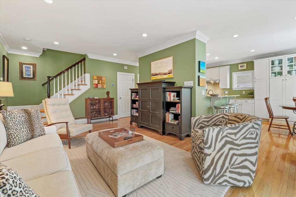 3 A Mill Street, Unit 3A Arlington, MA 02476 - Photo 15 of 38 a living room with furniture and a flat screen tv