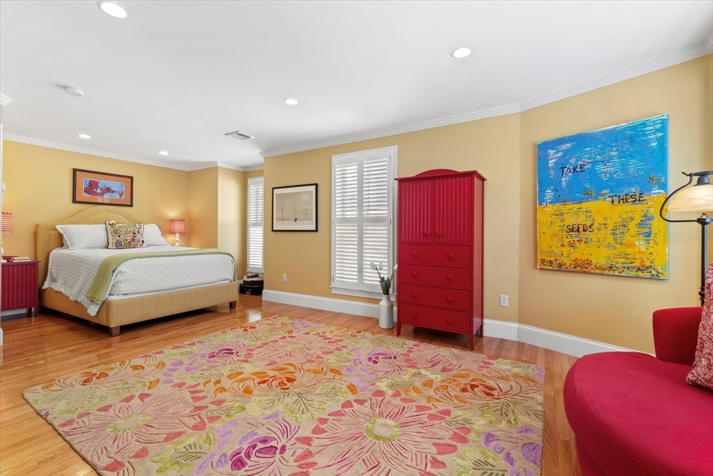 3 A Mill Street, Unit 3A Arlington, MA 02476 - Photo 17 of 38 a bedroom with a bed and a couch