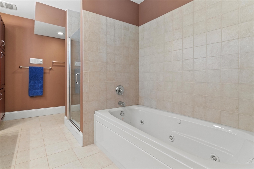 3 A Mill Street, Unit 3A Arlington, MA 02476 - Photo 24 of 38 a bathroom with a bathtub