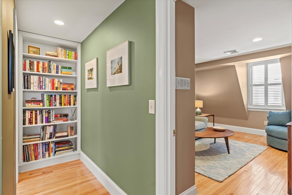 3 A Mill Street, Unit 3A Arlington, MA 02476 - Photo 29 of 38 a view of living room filled with furniture and book shelf