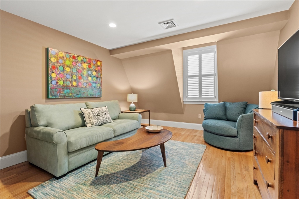 3 A Mill Street, Unit 3A Arlington, MA 02476 - Photo 31 of 38 a living room with furniture and a rug