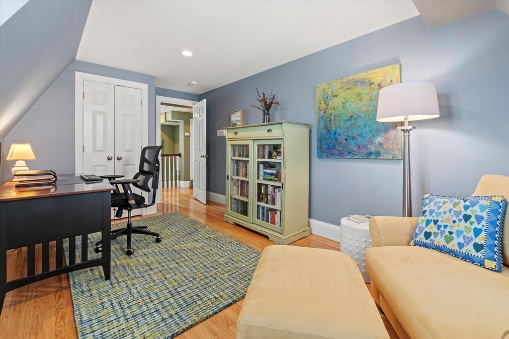 3 A Mill Street, Unit 3A Arlington, MA 02476 - Photo 34 of 38 a living room with furniture a lamp and a window