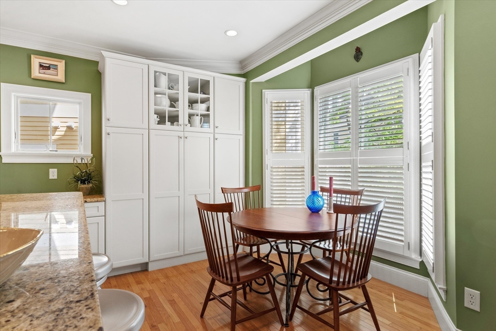 3 A Mill Street, Unit 3A Arlington, MA 02476 - Photo 10 of 38 a view of a dining room with furniture and wooden floor