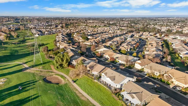 an aerial view of residential houses with outdoor space