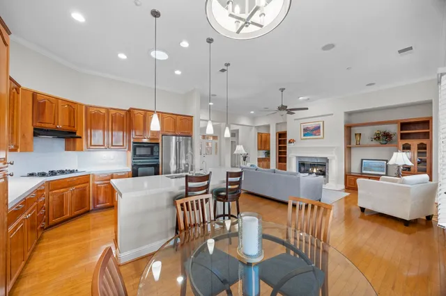 a kitchen with stainless steel appliances a refrigerator sink and cabinets