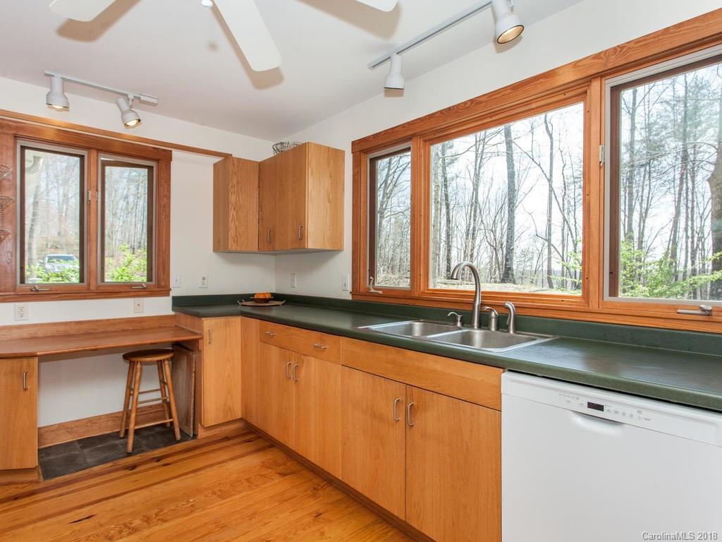 2831 Polk County Line Road Rutherfordton, NC 28139 - Photo 13 of 30 a kitchen with granite countertop a sink and a window