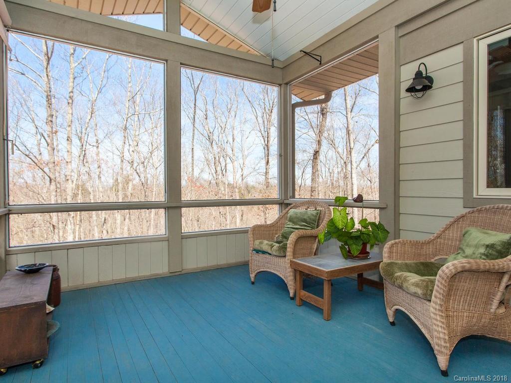 2831 Polk County Line Road Rutherfordton, NC 28139 - Photo 16 of 30 a living room with furniture and a floor to ceiling window