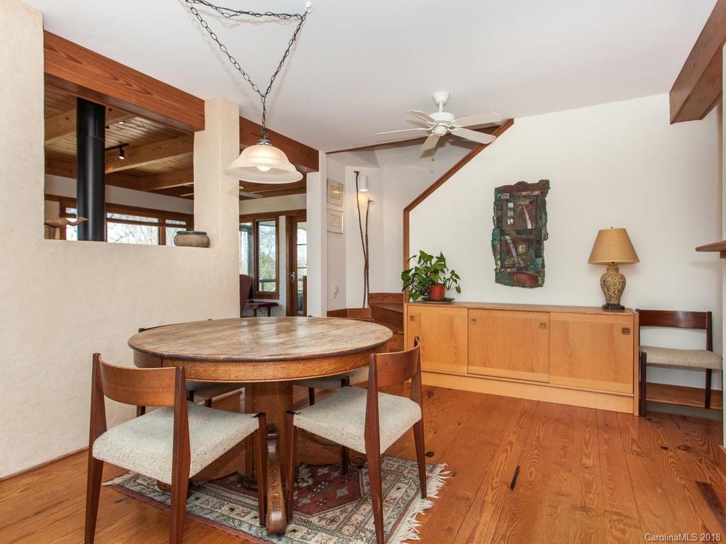 2831 Polk County Line Road Rutherfordton, NC 28139 - Photo 10 of 30 a dining room with a table and chairs