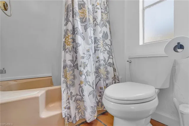 a bathroom with a sink mirror vanity and toilet