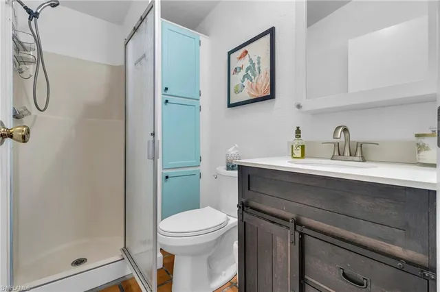 a room with furniture a rug and gym equipment