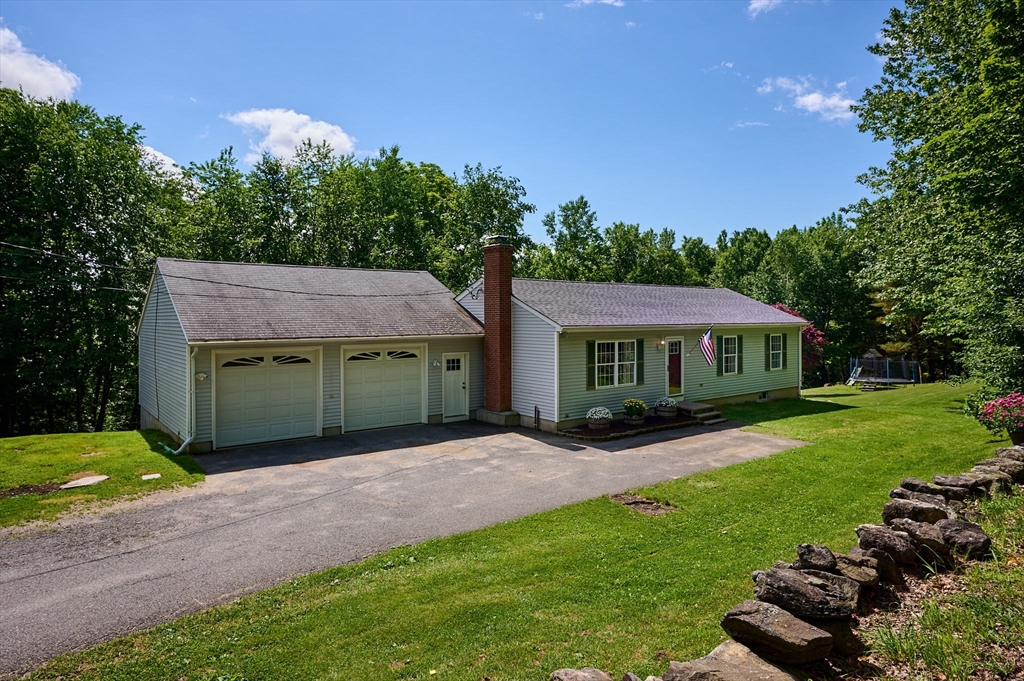 77 Reynolds Road Shelburne, MA 01370 - Photo 1 of 34 a view of a house with a garden