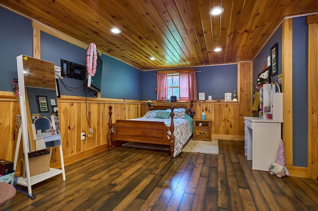 77 Reynolds Road Shelburne, MA 01370 - Photo 16 of 34 a bedroom with furniture and wooden floor