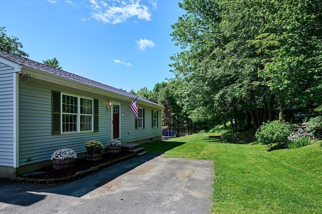 77 Reynolds Road Shelburne, MA 01370 - Photo 23 of 34 a front view of a house with garden