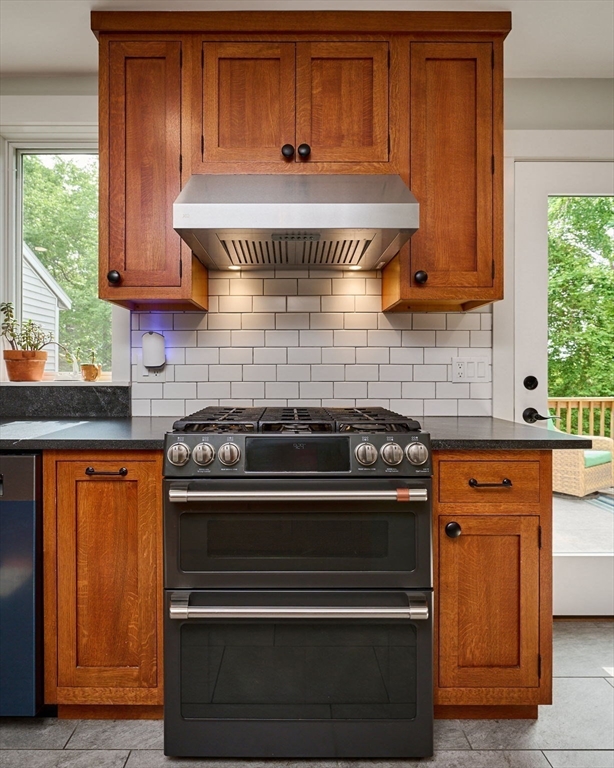 77 Reynolds Road Shelburne, MA 01370 - Photo 5 of 34 a kitchen with stainless steel appliances granite countertop wooden cabinets a stove and a sink
