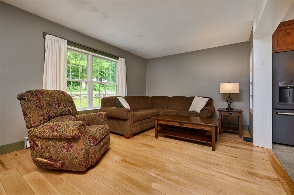 77 Reynolds Road Shelburne, MA 01370 - Photo 6 of 34 a living room with furniture and a large window