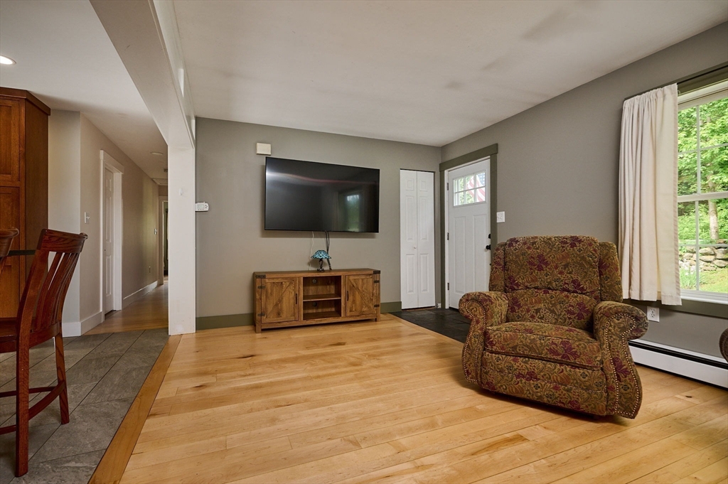 77 Reynolds Road Shelburne, MA 01370 - Photo 7 of 34 a living room with furniture and a flat screen tv