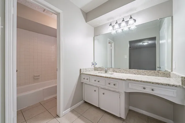 a picture of a bathroom with a shower