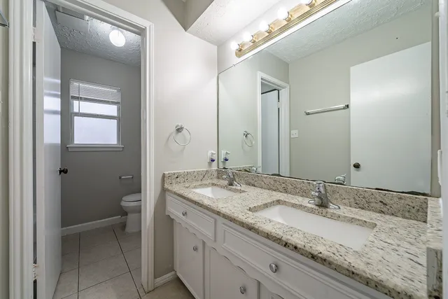 a picture of a bathroom with a shower