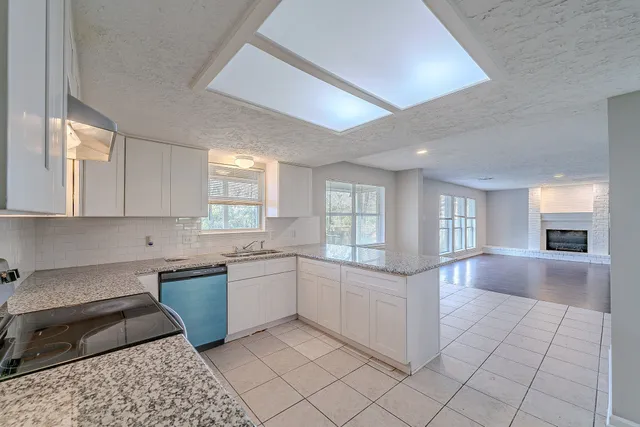 wooden floor in an empty room with a fireplace