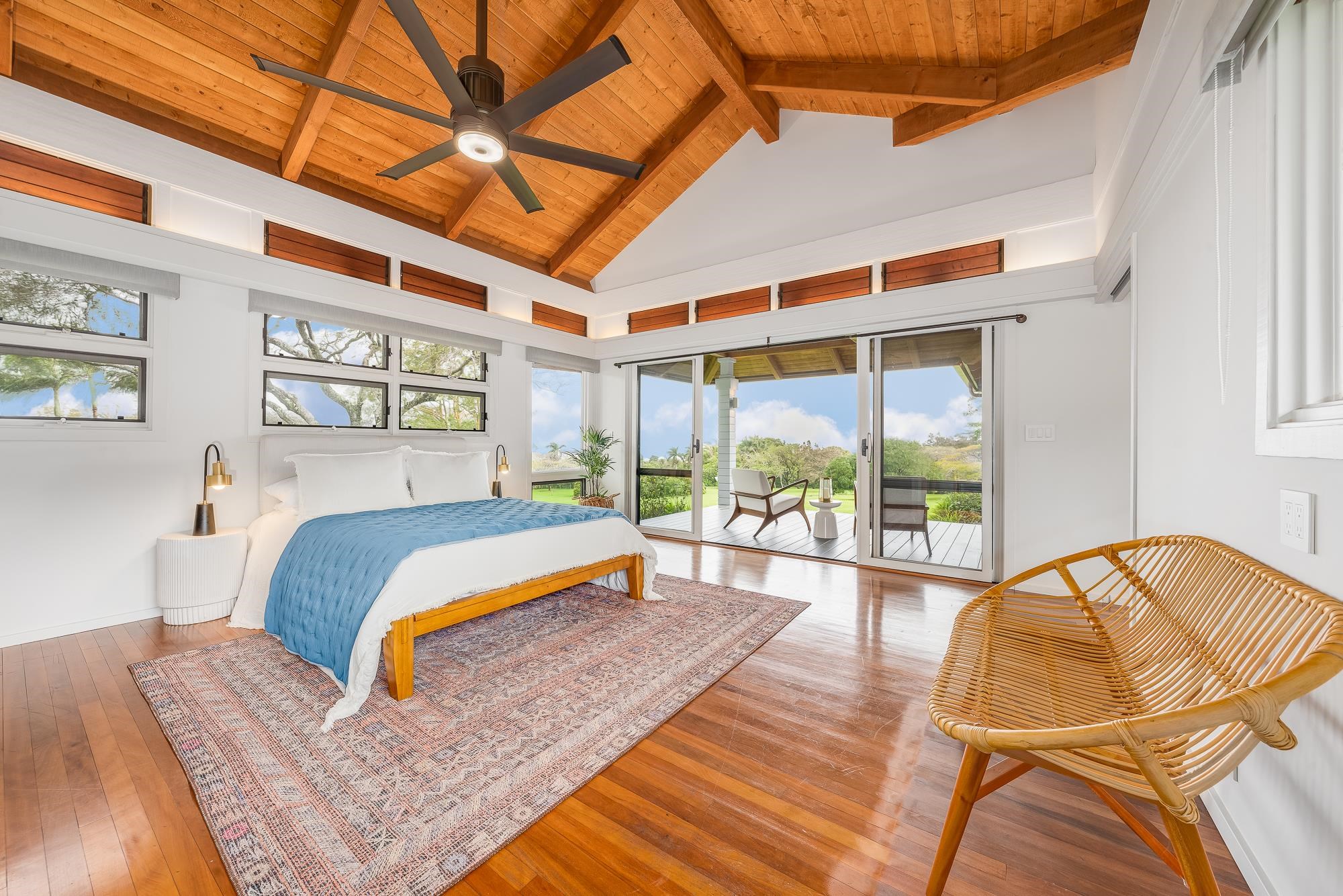 917 Hog Back Road Haiku, HI 96708 - Photo 16 of 30 a bedroom with a bed and a large window