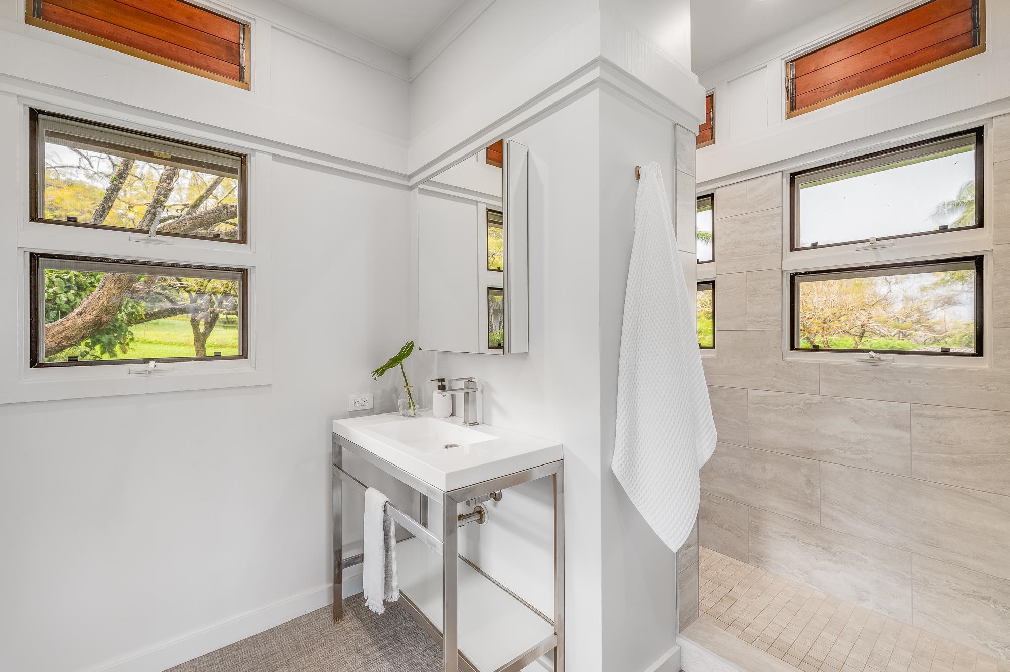 917 Hog Back Road Haiku, HI 96708 - Photo 17 of 30 a bathroom with a sink and a mirror