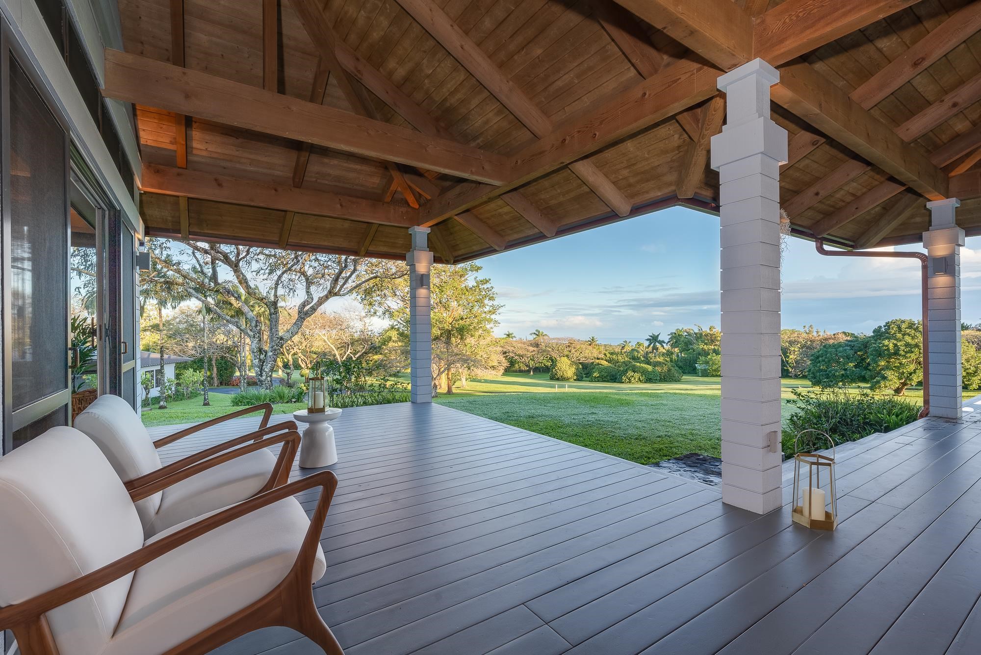 917 Hog Back Road Haiku, HI 96708 - Photo 18 of 30 a view of a porch with wooden floor chairs and table with wooden floor