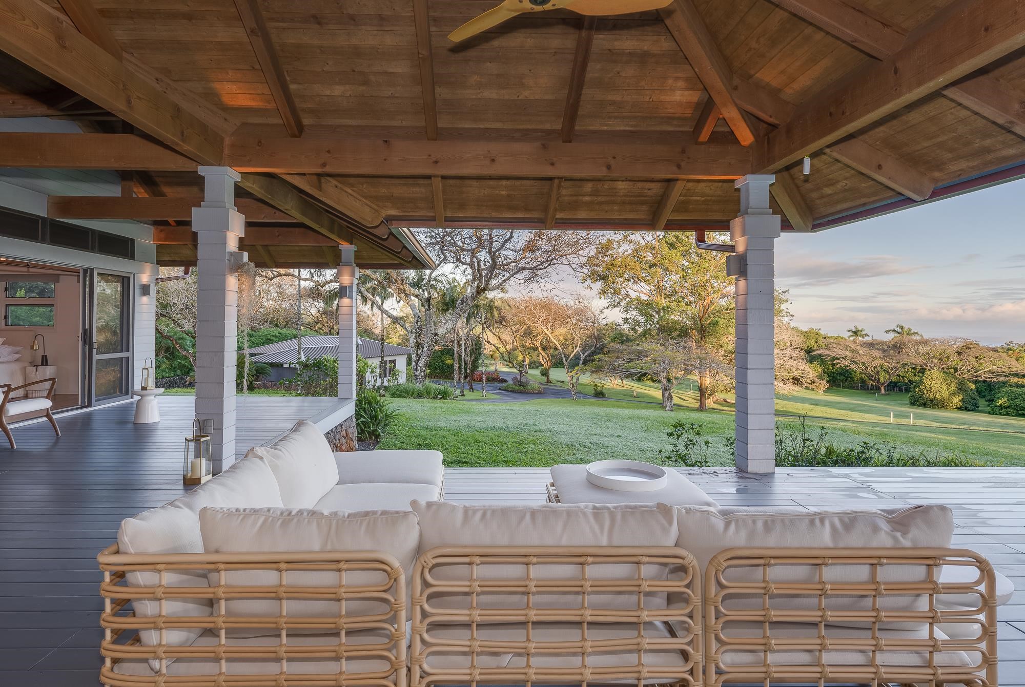 917 Hog Back Road Haiku, HI 96708 - Photo 20 of 30 a view of a patio with couches chairs and a table and chairs