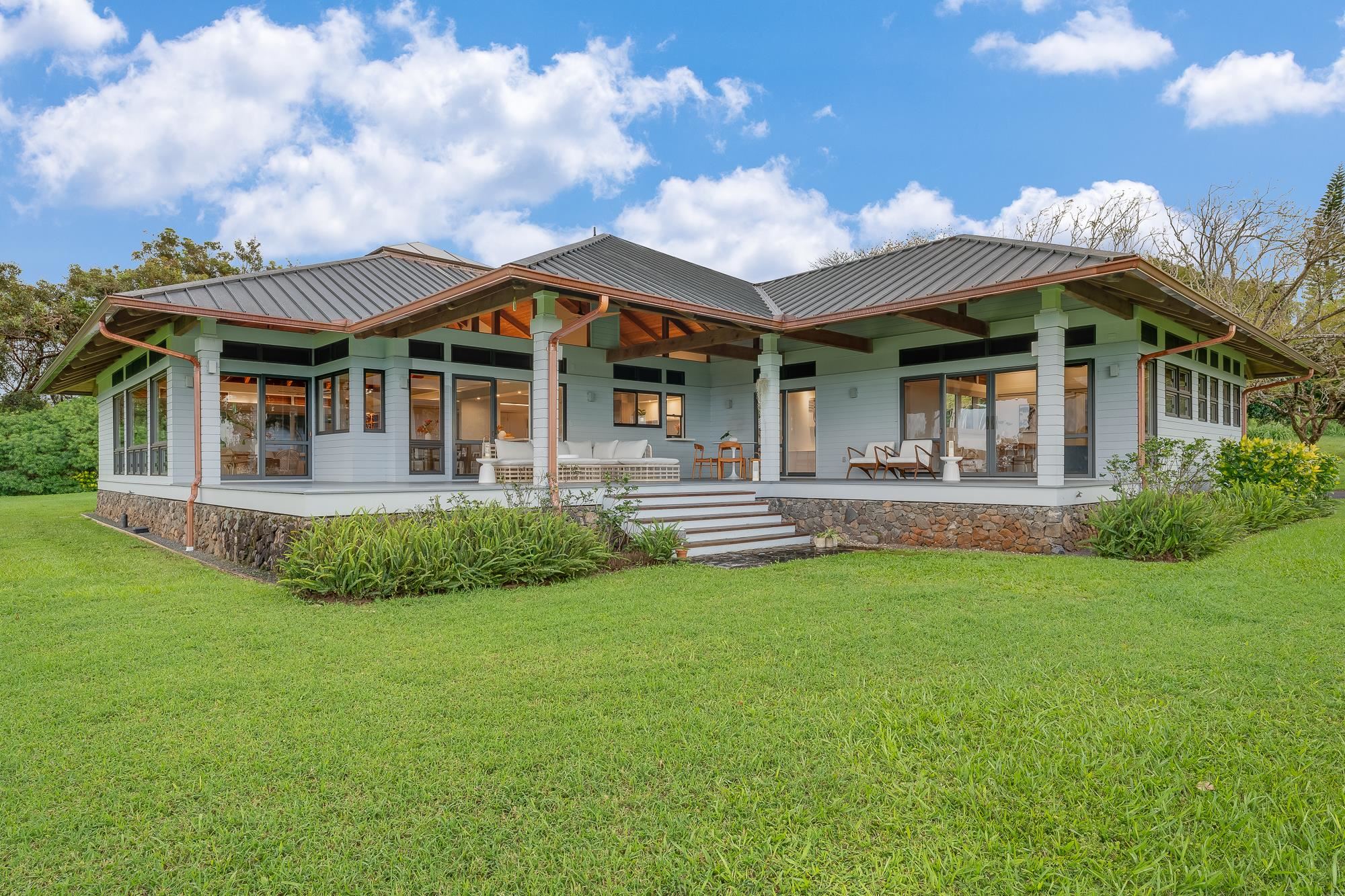 917 Hog Back Road Haiku, HI 96708 - Photo 2 of 30 a front view of house with yard and green space