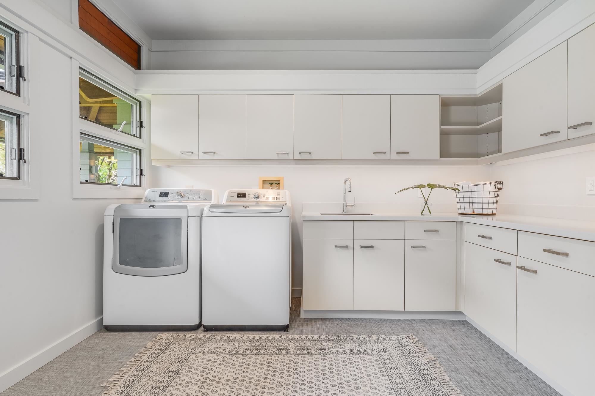 917 Hog Back Road Haiku, HI 96708 - Photo 21 of 30 a utility room with cabinets washer and dryer