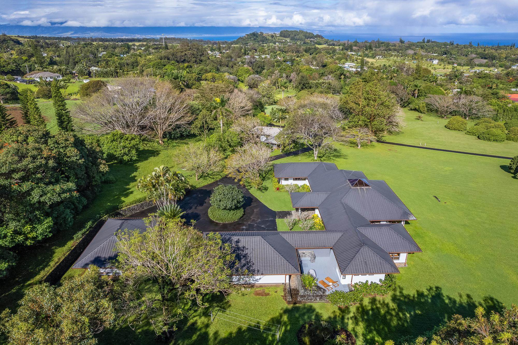 917 Hog Back Road Haiku, HI 96708 - Photo 29 of 30 an aerial view of a house with a yard