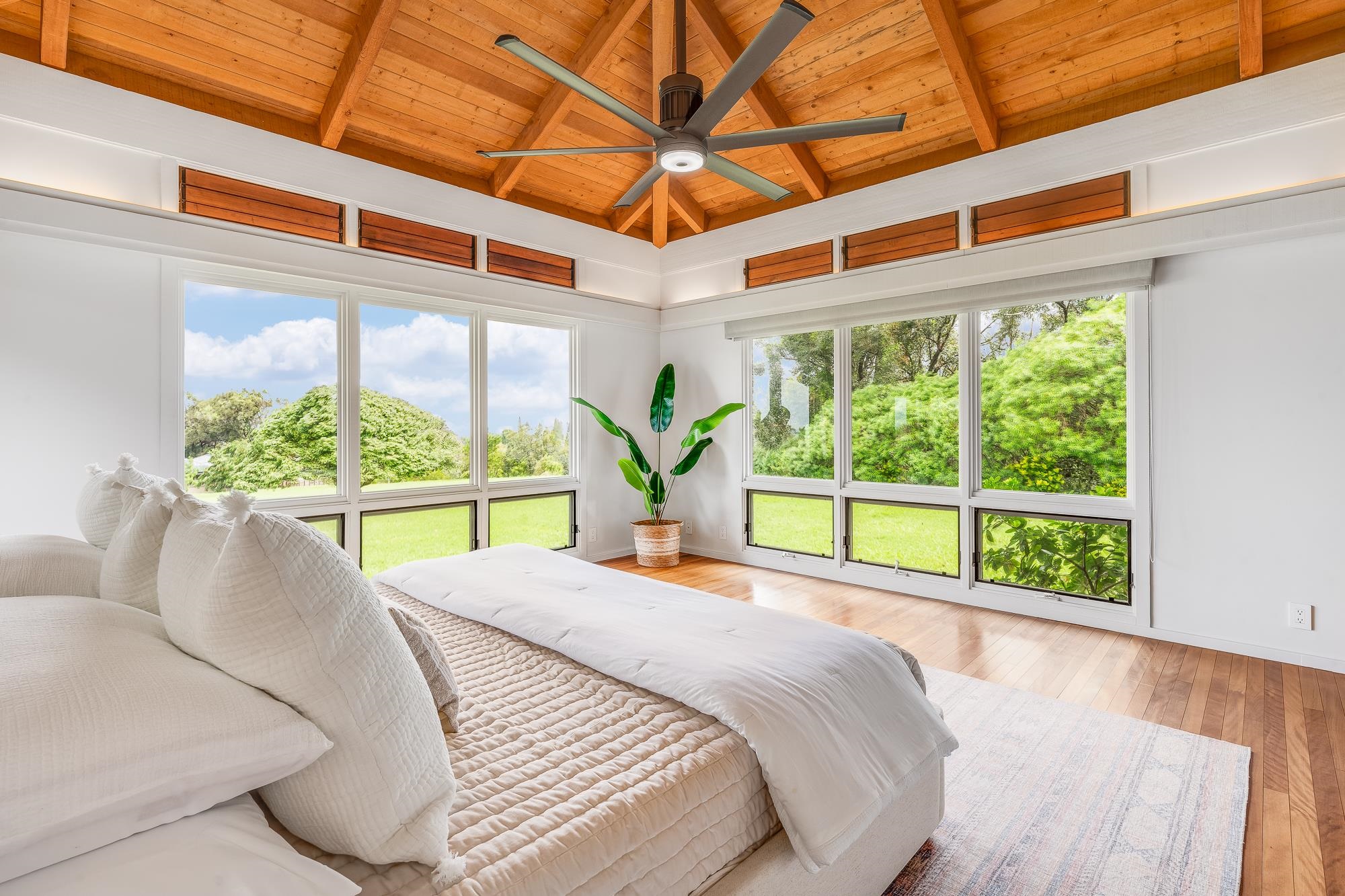 917 Hog Back Road Haiku, HI 96708 - Photo 10 of 30 a bed sitting in a bedroom next to a window