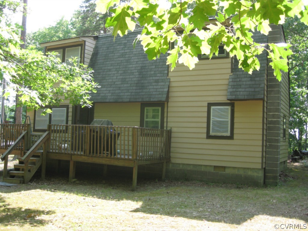 551 Buckskin Road Victoria, VA 23974 - Photo 2 of 18 a yellow house with trees in front of it