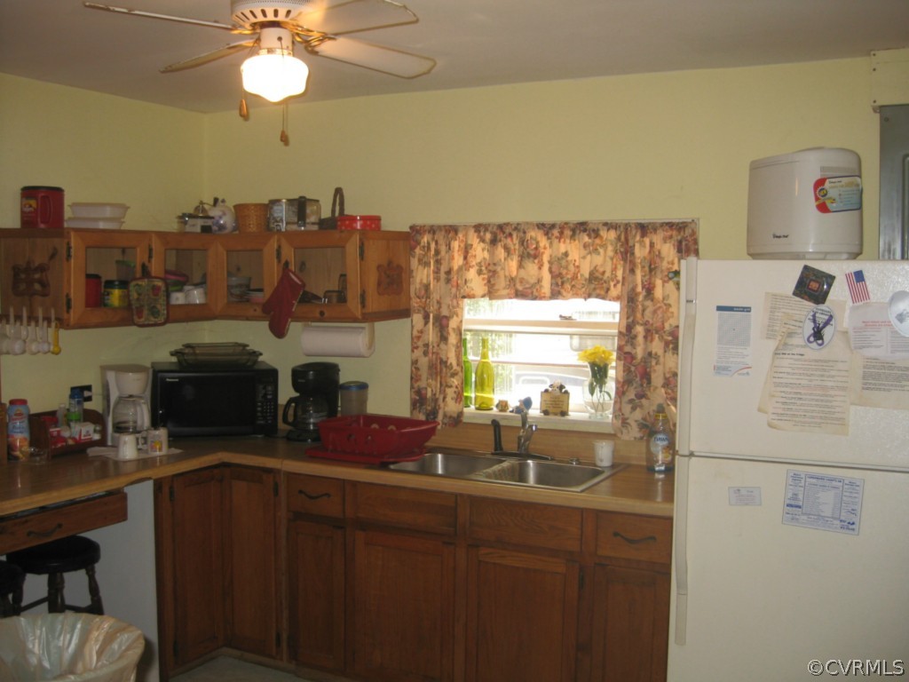 551 Buckskin Road Victoria, VA 23974 - Photo 3 of 18 a kitchen with a sink cabinets and window