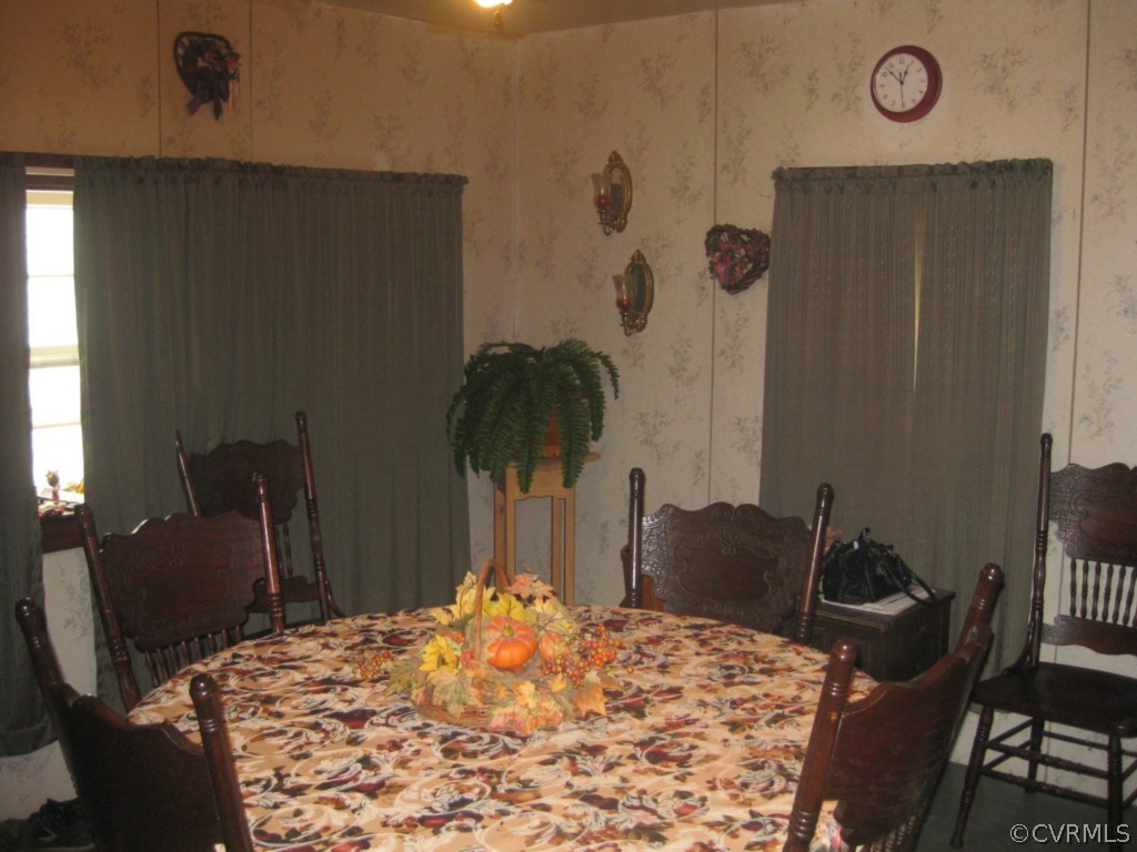 551 Buckskin Road Victoria, VA 23974 - Photo 8 of 18 a bedroom with a bed and a table in it
