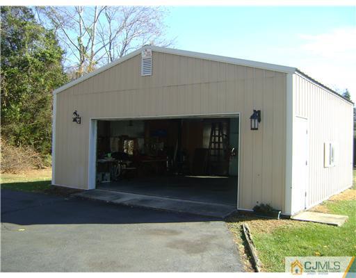 1437 Huron Road North Brunswick, NJ 08902 - Photo 2 of 11 a front view of a house with a yard