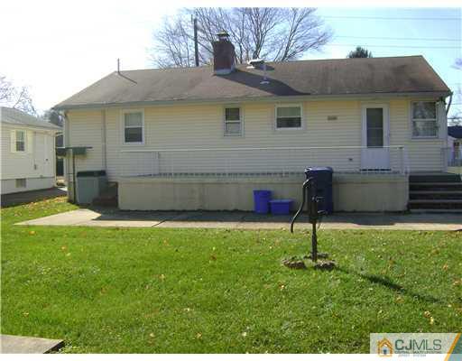 1437 Huron Road North Brunswick, NJ 08902 - Photo 11 of 11 a backyard of a house with barbeque oven