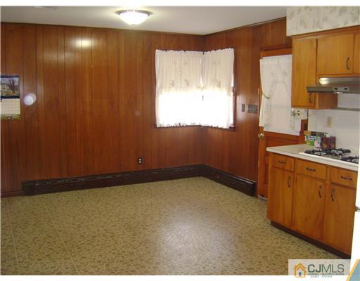 1437 Huron Road North Brunswick, NJ 08902 - Photo 4 of 11 a bathroom with a sink and a mirror