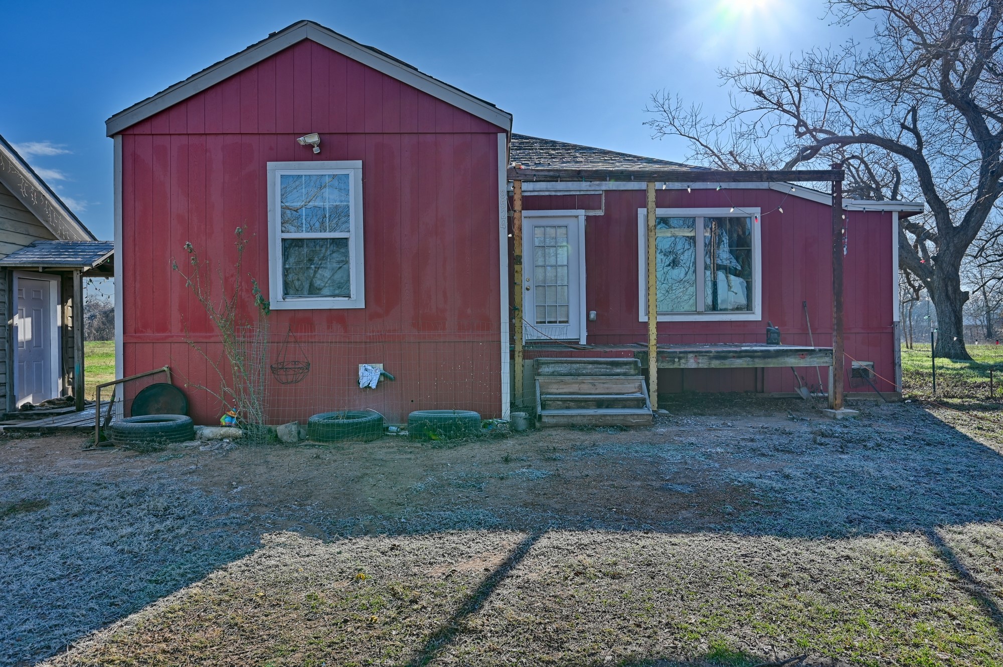 9524 Ferry Road Bellville, TX 77418 - Photo 1 of 15 a front view of a house with garden